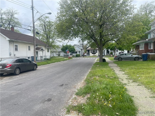 14 Thornton Ave, Buffalo, NY 14215 - view of asphalt street with street lighting, a residential view, and traffic signs