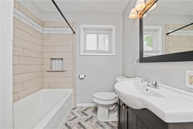 bathroom featuring toilet, shower / bath combination, baseboards, and vanity