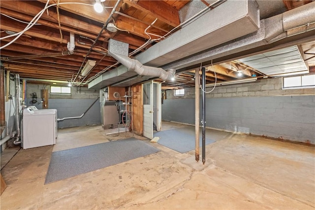 below grade area with washer / clothes dryer and plenty of natural light