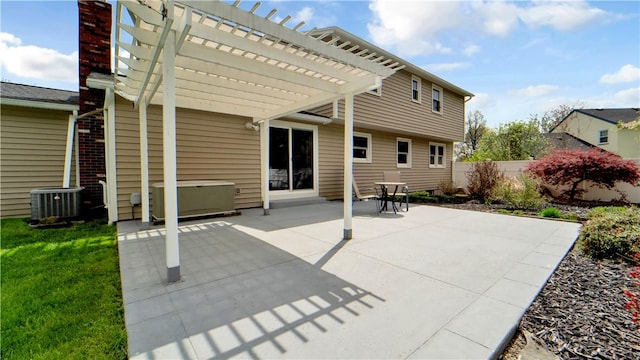 back of property with central AC, a pergola, fence, and a patio area