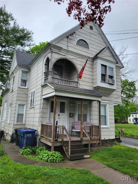 221 Grace St, Syracuse, NY 13204 - victorian home with a porch, roof with shingles, and central AC