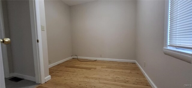 221 Grace St, Syracuse, NY 13204 - spare room with light wood-style floors and baseboards