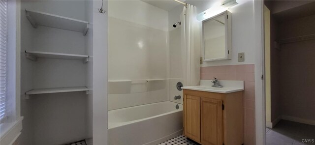221 Grace St, Syracuse, NY 13204 - bathroom with shower / bath combination with curtain, tile patterned flooring, vanity, and a spacious closet