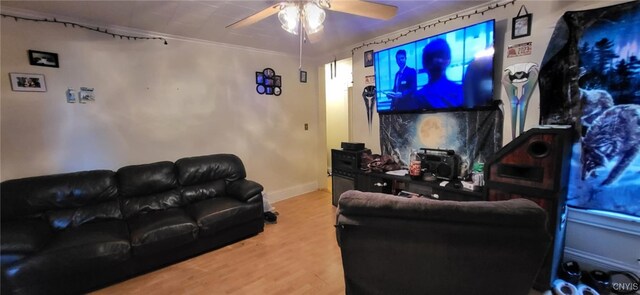 221 Grace St, Syracuse, NY 13204 - home theater room with a ceiling fan, wood finished floors, and baseboards