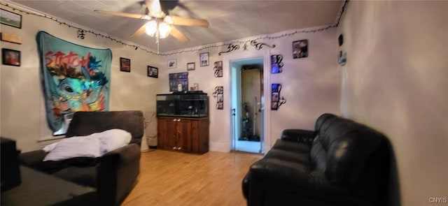 221 Grace St, Syracuse, NY 13204 - living area with ceiling fan and light wood-style floors