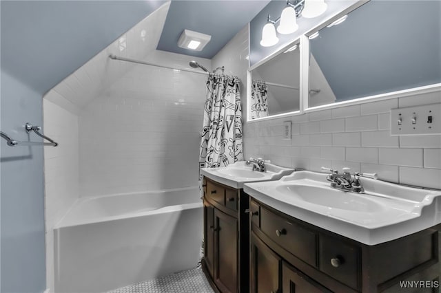 bathroom featuring shower / tub combo with curtain, backsplash, and vanity