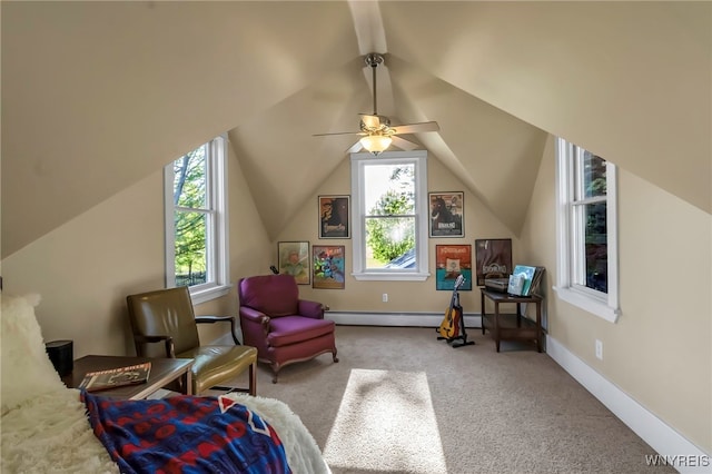 sitting room featuring plenty of natural light, a baseboard heating unit, carpet floors, lofted ceiling, and a ceiling fan