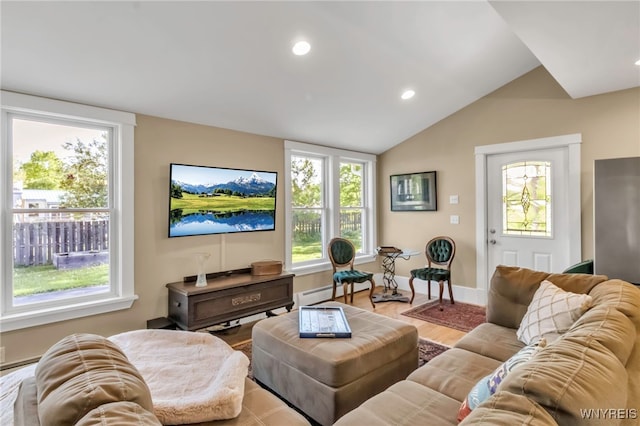 living area with recessed lighting, vaulted ceiling, light wood-type flooring, and baseboards