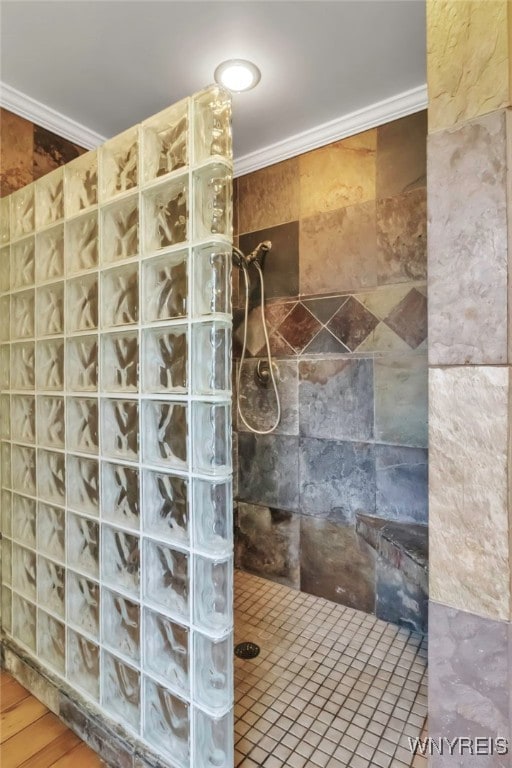 full bath featuring crown molding and walk in shower