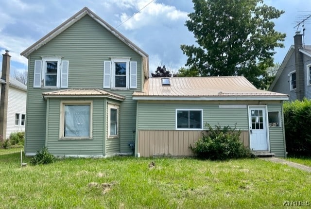 10713 Sisson Hwy, North Collins, NY 14057 - rear view of house with a yard and metal roof