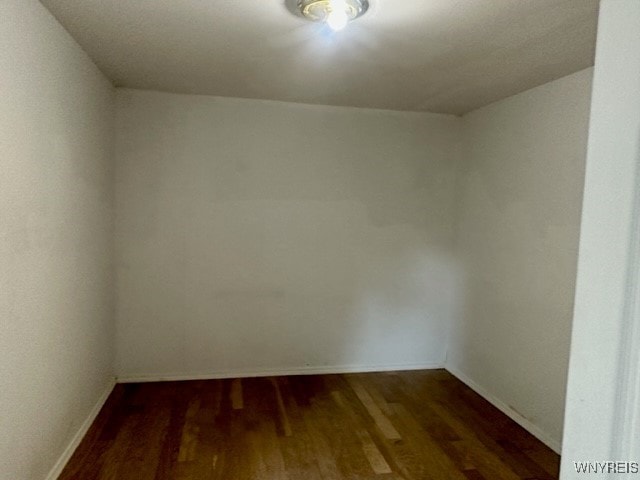 10713 Sisson Hwy, North Collins, NY 14057 - spare room featuring dark wood-style flooring and baseboards