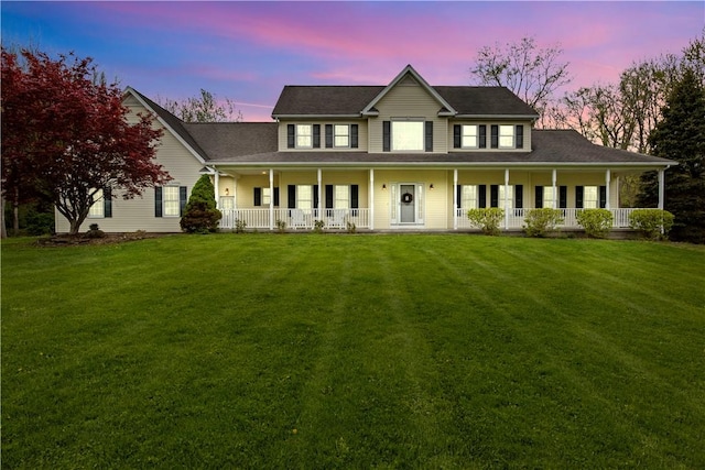 view of front of property with covered porch and a front lawn