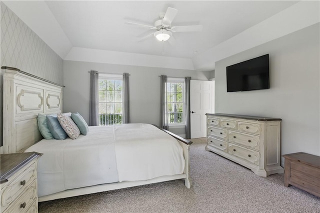 bedroom with light colored carpet and a ceiling fan