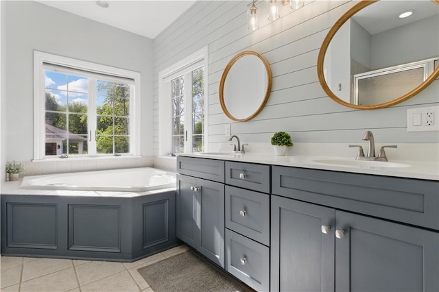 bathroom featuring tile patterned flooring, double vanity, a bath, an enclosed shower, and wooden walls