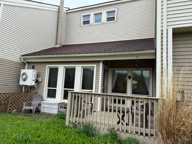 2128 Beta Dr Unit 21E, Virgil, NY 13045 - back of property with ac unit and a shingled roof