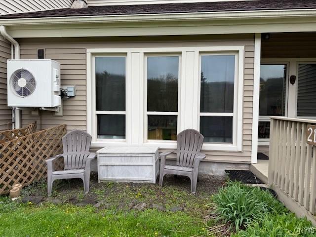 2128 Beta Dr Unit 21E, Virgil, NY 13045 - view of side of home featuring roof with shingles and ac unit