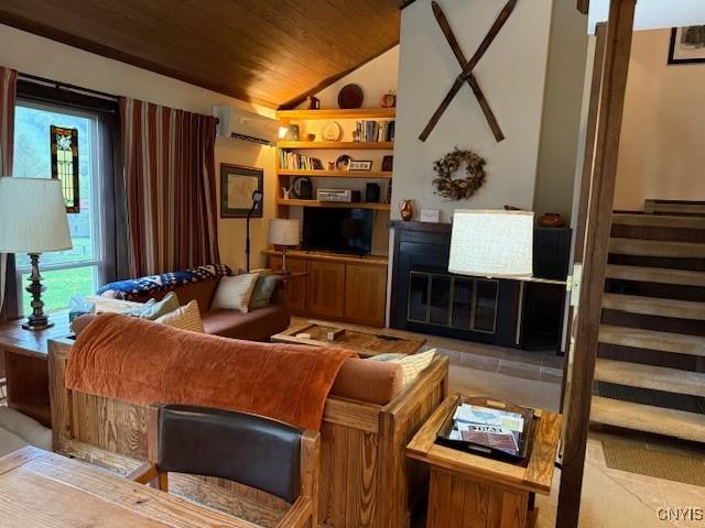 2128 Beta Dr Unit 21E, Virgil, NY 13045 - living area with wood ceiling, a wall mounted air conditioner, lofted ceiling, light tile patterned floors, and stairs