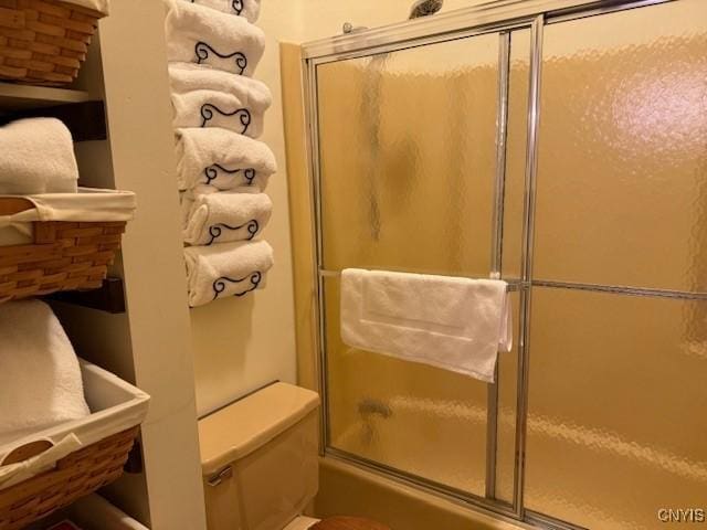 2128 Beta Dr Unit 21E, Virgil, NY 13045 - full bath with bath / shower combo with glass door and toilet