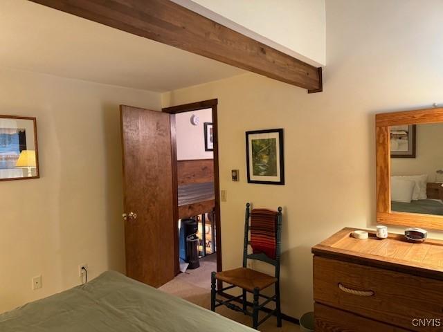 2128 Beta Dr Unit 21E, Virgil, NY 13045 - bedroom with beam ceiling and light colored carpet