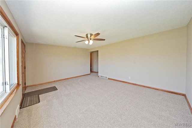 41 Della Dr, Lackawanna, NY 14218 - unfurnished room featuring baseboards, light carpet, and ceiling fan