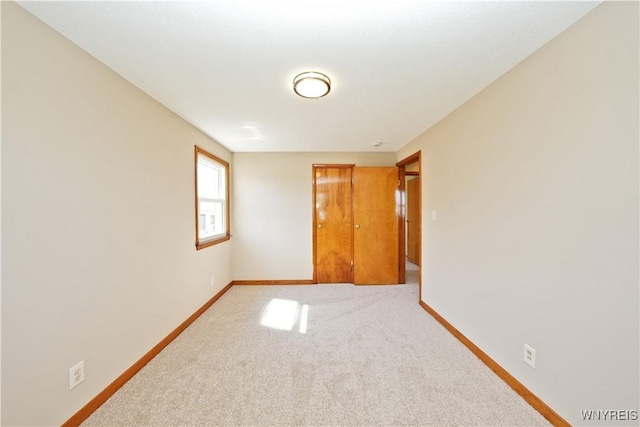 41 Della Dr, Lackawanna, NY 14218 - unfurnished bedroom with baseboards and carpet flooring