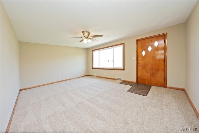 41 Della Dr, Lackawanna, NY 14218 - foyer entrance with light colored carpet, ceiling fan, and baseboards