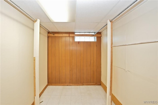 41 Della Dr, Lackawanna, NY 14218 - below grade area featuring wood walls, baseboards, and light flooring