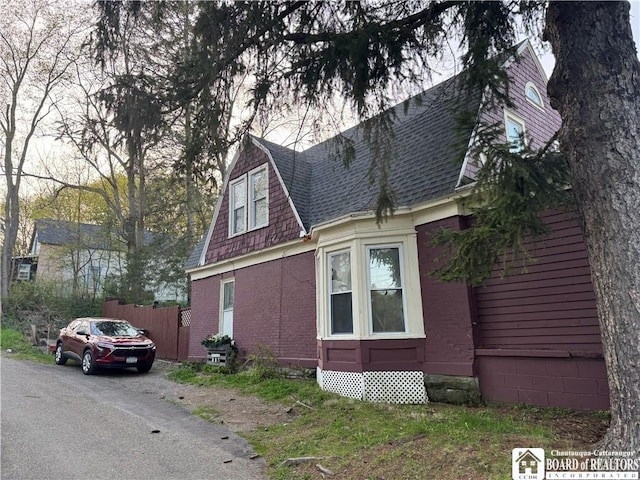 214 Hazzard St, Jamestown, NY 14701 - view of property exterior with a shingled roof and fence