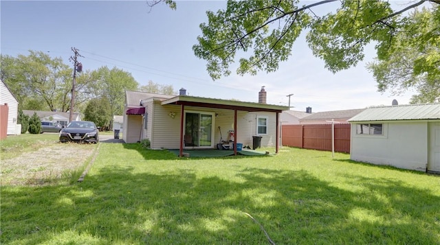 rear view of property with a chimney