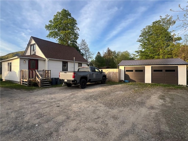 526 State Route 414, Catlin, NY 14812 - view of side of property with an outbuilding, a garage, dirt driveway, and fence
