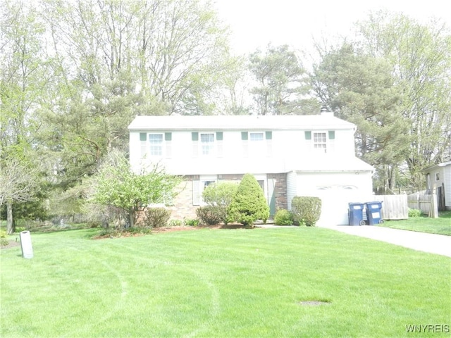 view of front of property featuring a garage and concrete driveway