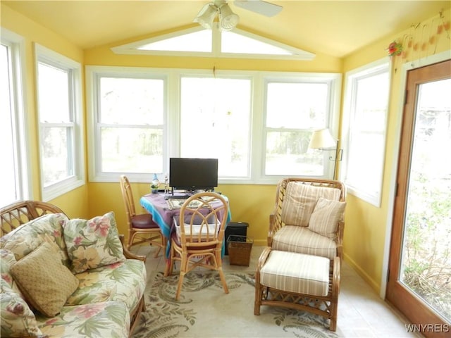 sunroom / solarium with lofted ceiling and baseboards