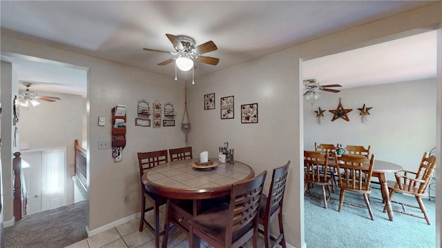 6 Club View Dr, Bath, NY 14810 - dining space with light carpet, a ceiling fan, baseboards, and light tile patterned flooring