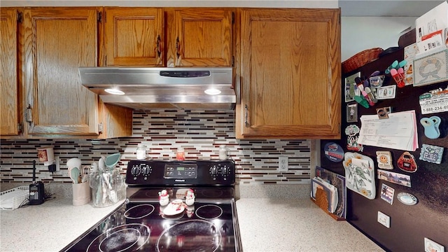 6 Club View Dr, Bath, NY 14810 - kitchen featuring freestanding refrigerator, under cabinet range hood, black / electric stove, and brown cabinetry