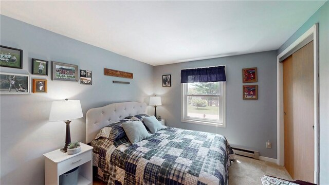 6 Club View Dr, Bath, NY 14810 - bedroom with baseboard heating, carpet flooring, baseboards, and a closet