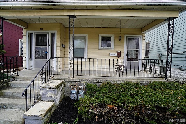 54 Pine Ridge Rd, Cheektowaga, NY 14211 - entrance to property with a porch