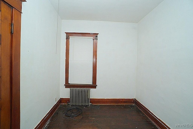 54 Pine Ridge Rd, Cheektowaga, NY 14211 - spare room featuring radiator heating unit, wood finished floors, and baseboards