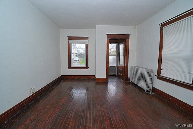 54 Pine Ridge Rd, Cheektowaga, NY 14211 - spare room with radiator, baseboards, and hardwood / wood-style flooring