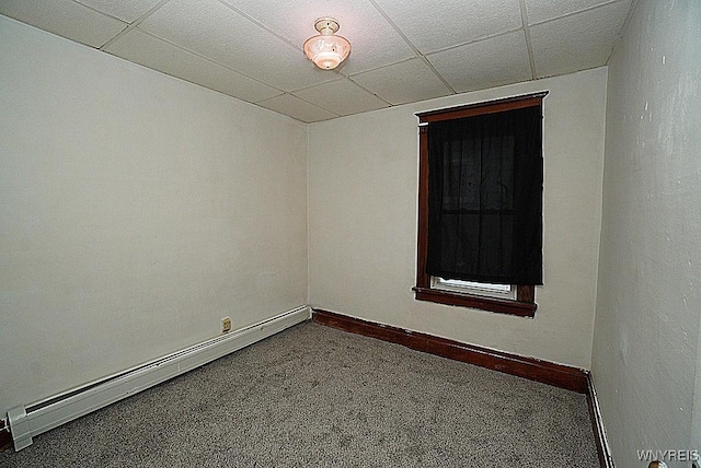 54 Pine Ridge Rd, Cheektowaga, NY 14211 - empty room featuring a baseboard heating unit, carpet flooring, a drop ceiling, and baseboards