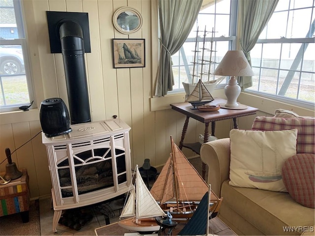 13202 Park Rd, Carlton, NY 14571 - living room featuring healthy amount of natural light, a wood stove, and a decorative wall