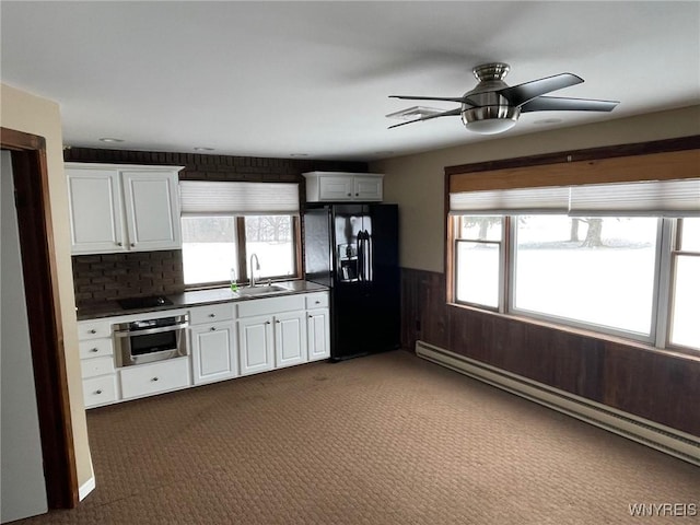 1068 Meiser Rd, Alabama, NY 14036 - kitchen featuring black refrigerator with ice dispenser, oven, a baseboard heating unit, ceiling fan, and dark countertops