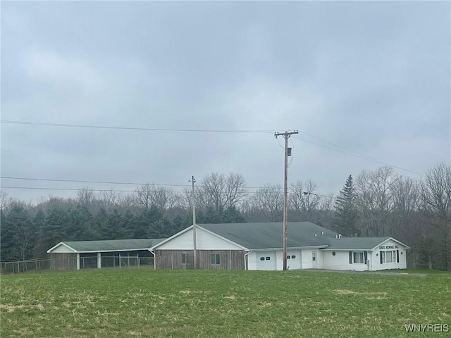 1068 Meiser Rd, Alabama, NY 14036 - view of front facade featuring a front lawn and a forest view