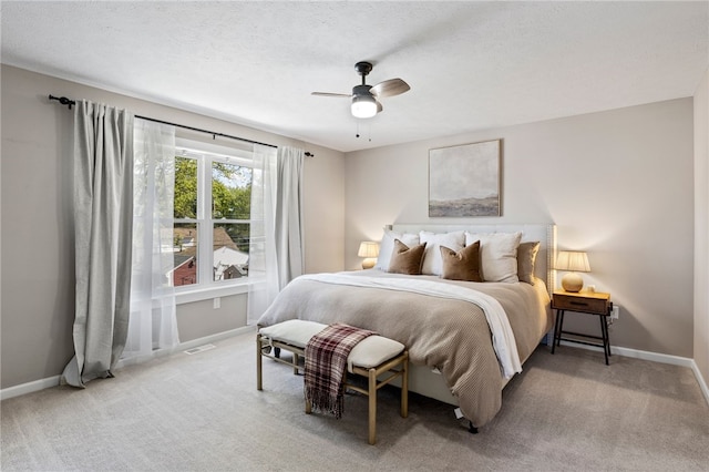 bedroom featuring carpet, baseboards, and ceiling fan