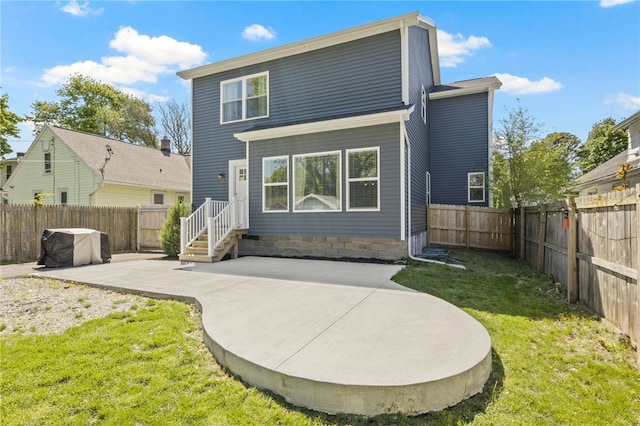 rear view of house with a patio