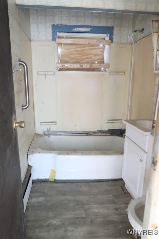 5910 Porter Rd, Niagara, NY 14304 - bathroom with vanity and baseboard heating