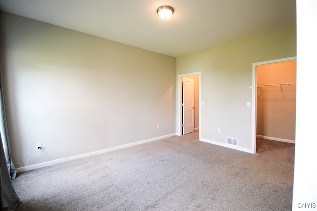 522 Chenango Hill Dr, Hamilton, NY 13346 - unfurnished bedroom featuring carpet, baseboards, a spacious closet, and a closet