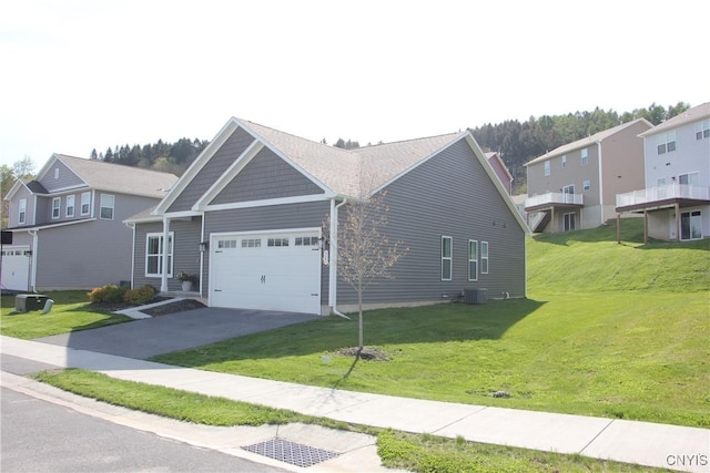 522 Chenango Hill Dr, Hamilton, NY 13346 - view of front of property with central AC unit, an attached garage, a front yard, and driveway