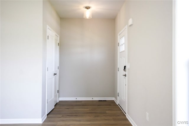 522 Chenango Hill Dr, Hamilton, NY 13346 - doorway to outside featuring baseboards and dark wood-style floors