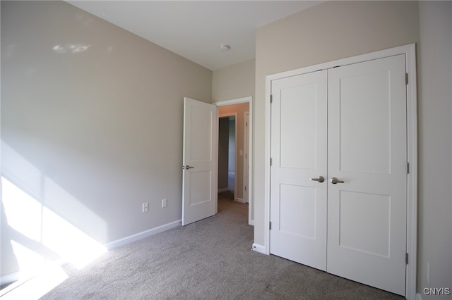522 Chenango Hill Dr, Hamilton, NY 13346 - unfurnished bedroom with carpet flooring, a closet, and baseboards