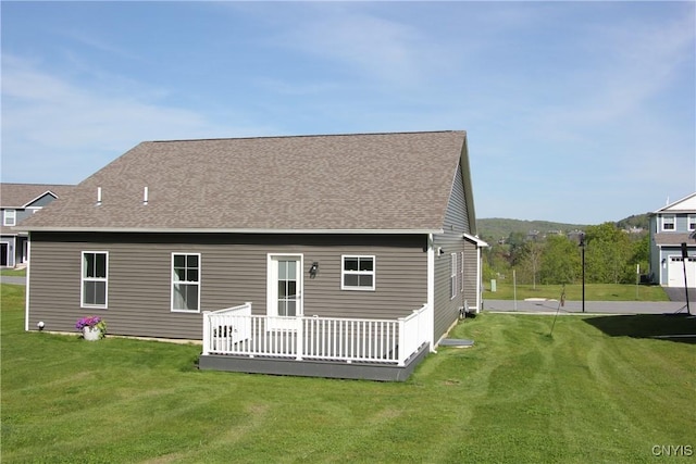 522 Chenango Hill Dr, Hamilton, NY 13346 - rear view of property featuring a lawn, a wooden deck, and roof with shingles